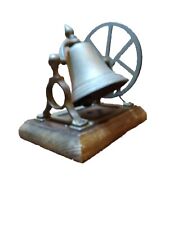 VINTAGE  BRASS BELL AND WHEEL BRACKET ON WOODEN BASE picture