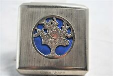 1950's latched Chrome compact with punch relief of a basket of flowers on top picture