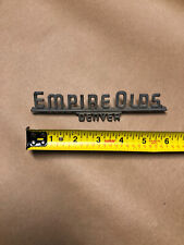 Metal Auto Car Dealer Emblem Badge Name Plate Empire Oldsmobile Denver trunk picture