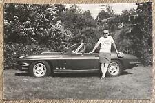 1970s RPPC Photo Postcard Man in Corvette Shirt Poses with 1960s Stingray Car picture