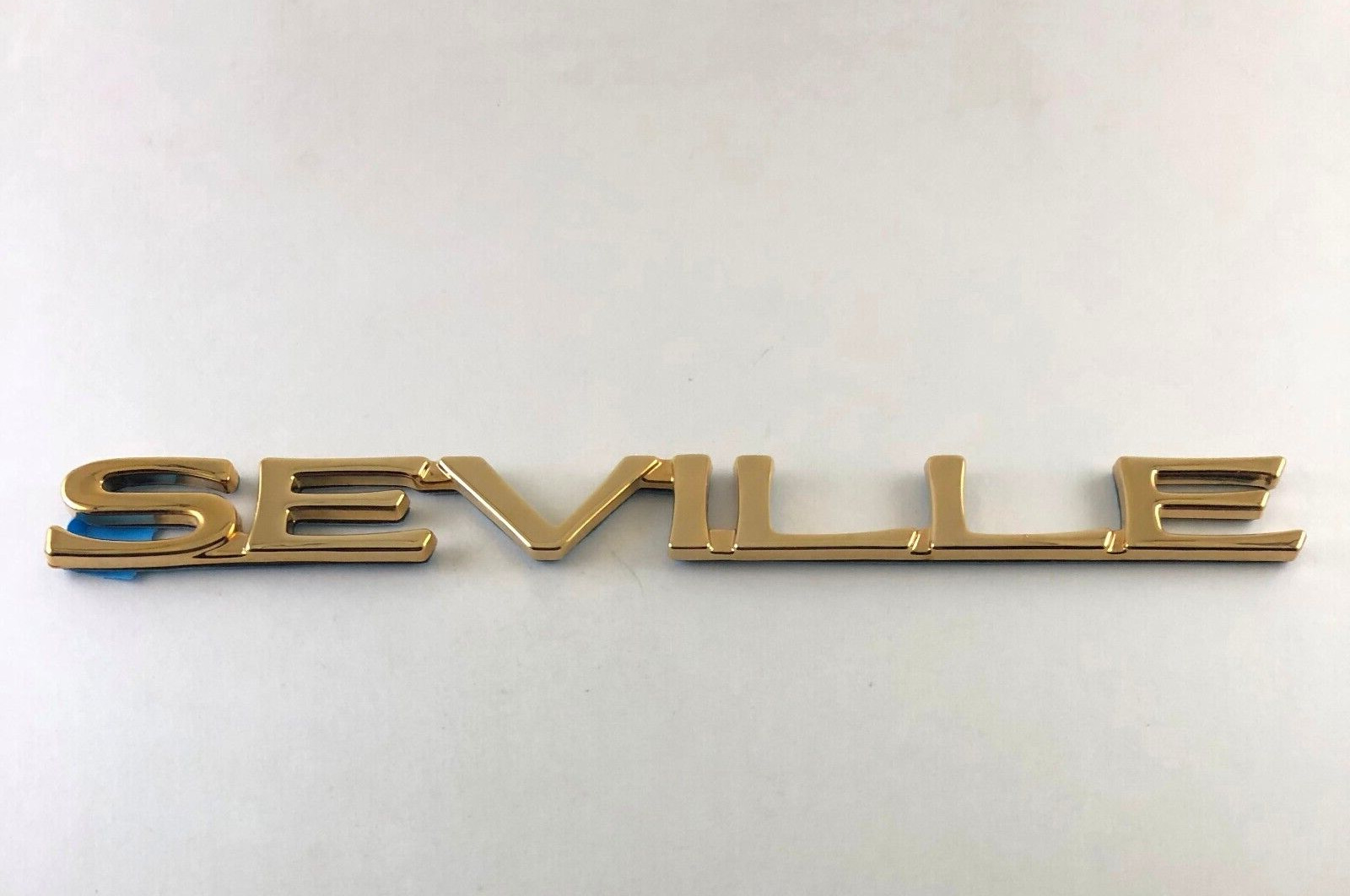 Cadillac SEVILLE emblem gold plated new GM part