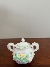 Overview This is a vintage ceramic covered sugar bowl featuring embossed  picture