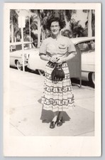 RPPC c1950s Woman in Long Skirt Automobiles Cars in Background Postcard picture