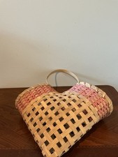 Overview This charming vintage heart-shaped woven splint basket features  picture