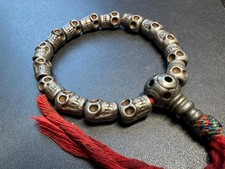 Tibetan Iron Skull Wrist Mala Bracelet | 10mm Charnel Ground Beads, Red Tassel, picture