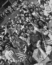 High angle view revellers one holding a newspaper headline Complet- Old Photo picture