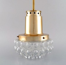 Helena Tynell for Limburg. Ceiling pendant in clear art glass and brass. 1970s. picture