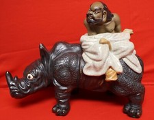 BUDDA MAN RIDING ON A Rhino Porcelain -Heavy 18.2lb. Tag No. G450. picture