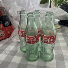 4 Coca Cola Classic Christmas 2000 Edition Bottles picture