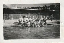 Vintage photograph, shirtless mature men at swimming pool, gay interest picture