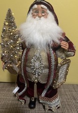 Santa Claus figure in red robe by Karen Didion with light up Christmas Tree picture