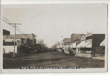 1908 CANEY KANSAS KS RPPC MAIN STREET SCENE - DYER DRY GOODS STORE - BOWERS CARD picture