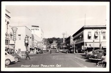 Postcard RPPC Oregon OR Pendleton 1947 Downtown Drug Store Movie Theatre Cars picture