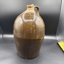 A 19th-century American Southern stoneware jug with a brown glaze. picture