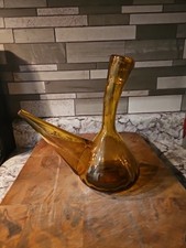 A vintage amber glass Spanish porrón wine decanter picture