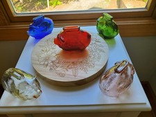 5 Vintage glass piggy banks (red pink blue green amber) & engraved wood base picture