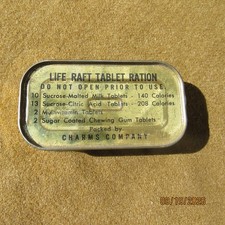 POST WWII US NAVY PARACHUTE LIFE RAFT TABLET RATION CHARMS COMPANY SEALED picture