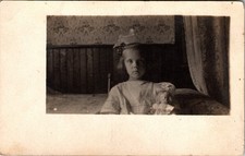 Postcard Real Photo RPPC Little Girl Sitting in Chair with Doll picture