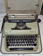 Vintage OLYMPIA SM3 De Luxe Typewriter in Dark Green with Case picture