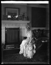 Photo:Eliz Howry 1919 1920 Woman in Victorian Dress by Fireplace picture