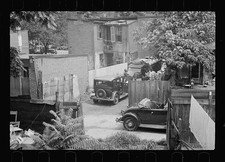 Photo:1930s Slum Housing Automobiles Clotheslines Laundry Fenced Yard picture