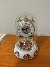 This is a vintage anniversary clock featuring the Royal Albert Old Country picture