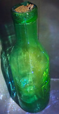Vtg Green Glass Absolutely Pure Milk Bottle The Milk Protector 365nm UV Glow picture