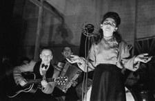 Shop worker Sadie Davis entertains fellow employees a song Dick- 1941 Old Photo picture