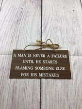 Vintage Man Is Never A Failure Plastic Woodgrain Sign picture