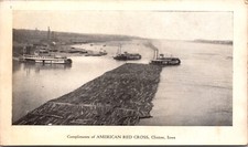 PC Boats Moving Logs in River Compliments of American Red Cross in Clinton, Iowa picture