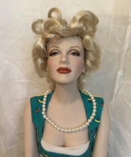 Marilyn Monroe Porcelain On Bench Franklin Mint. Beautiful picture