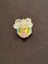 Glass bee with pink flower on mirror picture
