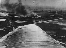 Pall of smoke rising as bombers roar over outskirts of Warsaw duri- Old Photo picture