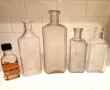 Lot of 5 Clear Embossed Glass Medicine Bottles Includes Red Cross Prescriptions picture