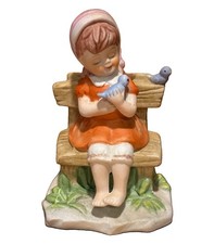 Vintage Ceramic Girl on Bench Holding Bird Figurine Unmarked 5” picture