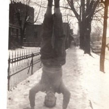 c1940s Boy Doing Headstand in Snow Sidewalk Snapshot Photo Fence Winter Cars Vtg picture