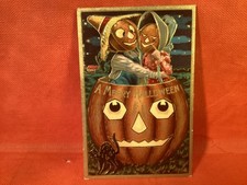 VINTAGE HALLOWEEN EARLY EMBOSSED POST CARD NOT POSTED JOL COUPLE IN HEAD OF JOL picture