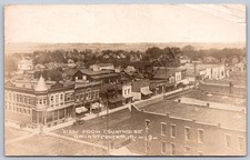 K41/ Grundy Center Iowa RPPC Postcard c1910 Stores from Court House 373 picture