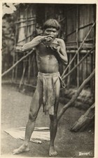 PC BORNEO MALAYSIA DAYAK NATIVE MAN EATING REAL PHOTO POSTCARD (b71797) picture