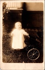 Infant Baby in White Dress Pushing Stroller Outdoor Postcard Real Photo RPPC picture