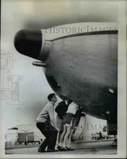 1962 Press Photo Curious Boys Stick Their Noses Into Massive Bulbous of Argosy picture