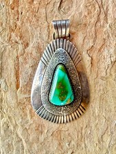Vintage Navajo sterling silver pendant with turquoise picture