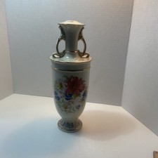 A Vintage Porcelain Amphora Style Vase With Two Ornate Gold Trimmed Handles. picture