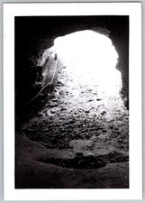 Vtg B&W Snapshot Interior View Of Large Cave With Wooden Stairs & Light 1950s picture