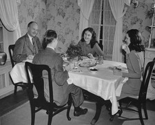 Two men and two women talking over dinner circa 1940 Historic Old Photo picture