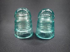 Pair of Antique Brookfield CD 104 Glass Insulators - NET&T Co. picture