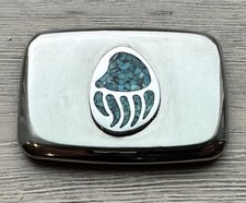 Native American style belt buckle featuring a chip inlay turquoise bear paw picture