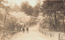 2 MEN RIDING HORSES DOWN DIRT ROAD WITH WOOD FENCE REAL PHOTO POSTCARD 1929 RPPC picture