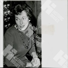 1963 B&W Photo of a woman wearing a necklace and long-sleeved shirt picture