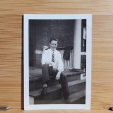 2 Vintage B&W photos Young Man on porch 2.5”x3.5” approx. Mar 1942 picture